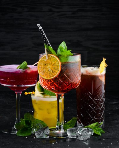 Beautiful colorful cocktails in the glasses on the bar.