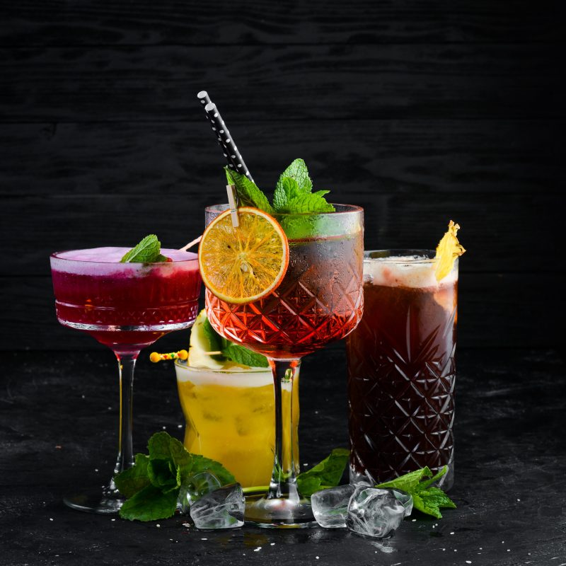 Beautiful colorful cocktails in the glasses on the bar.