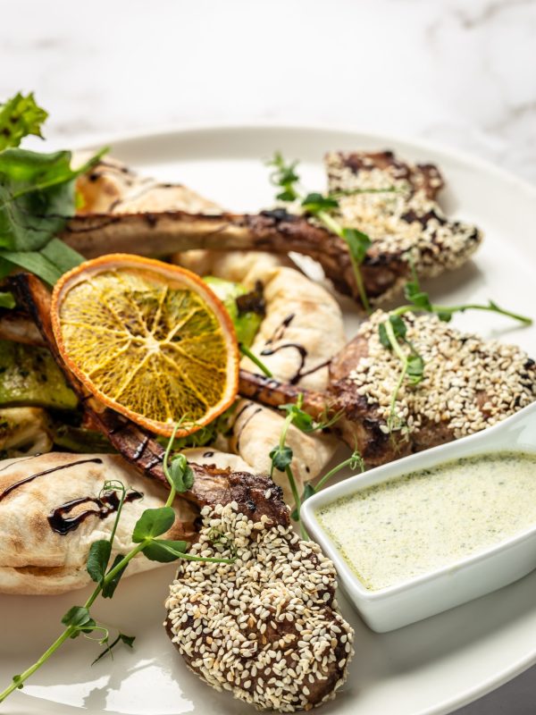 Lamb rack with pita bread and vegetables salad. Turkish shashlik. oriental cuisine. vertical image. top view. place for text.